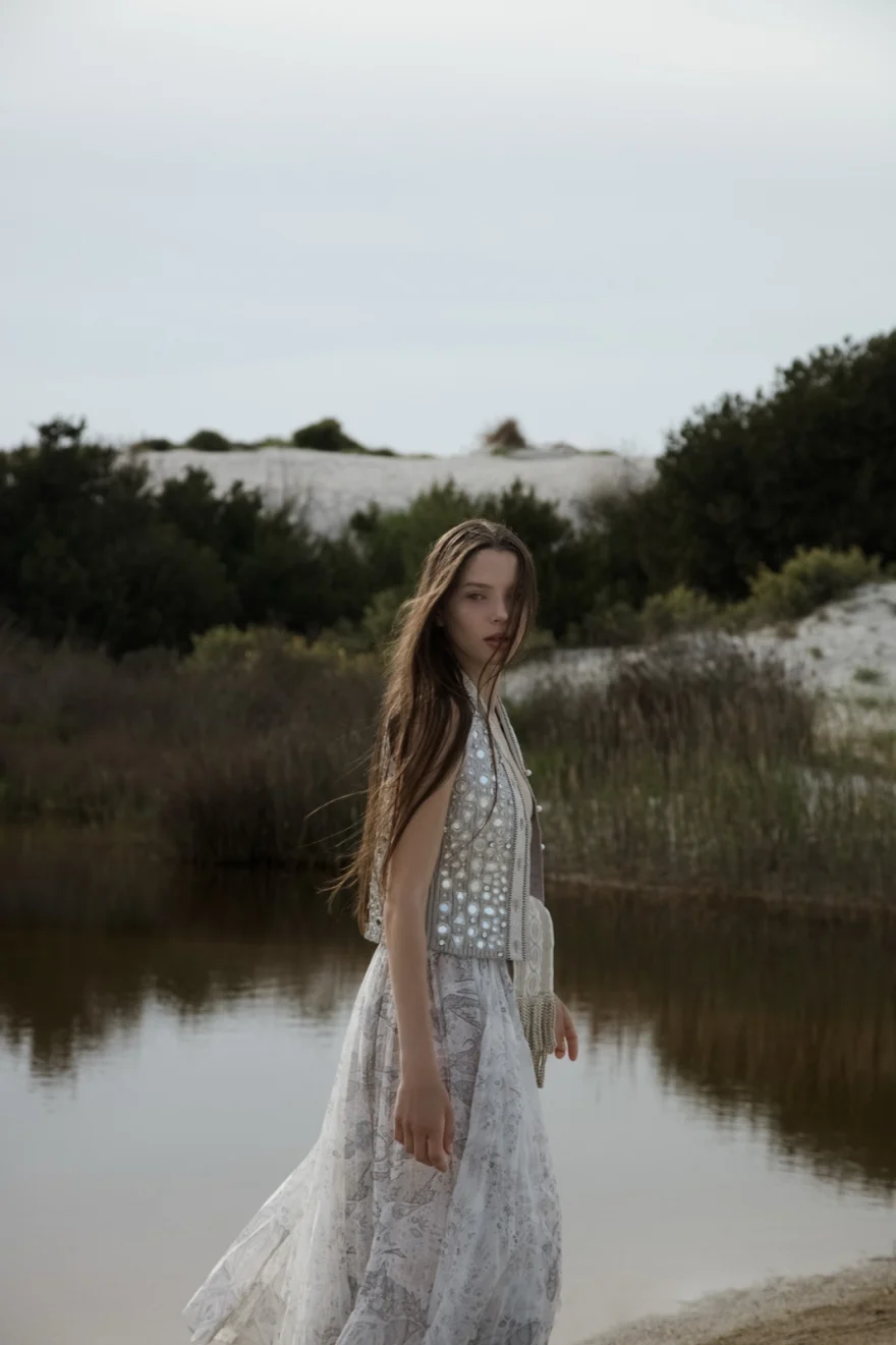 Model in an embellished ETRO dress beside still water, ETRO × SHOT Magazine editorial photographed by Ina Cenusa