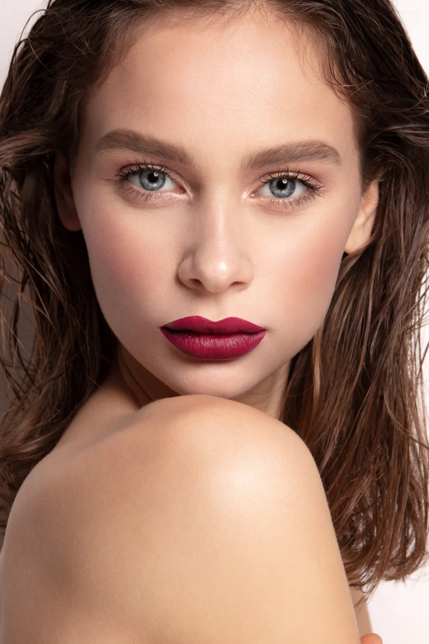 Beauty portrait with deep berry lips, looking over a bare shoulder, Philip Martin's campaign photographed by Ina Cenusa