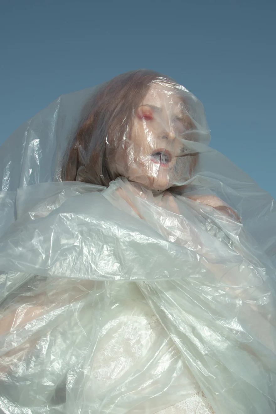 Portrait seen through a translucent veil against a blue sky, SHOT Magazine editorial photographed by Ina Cenusa