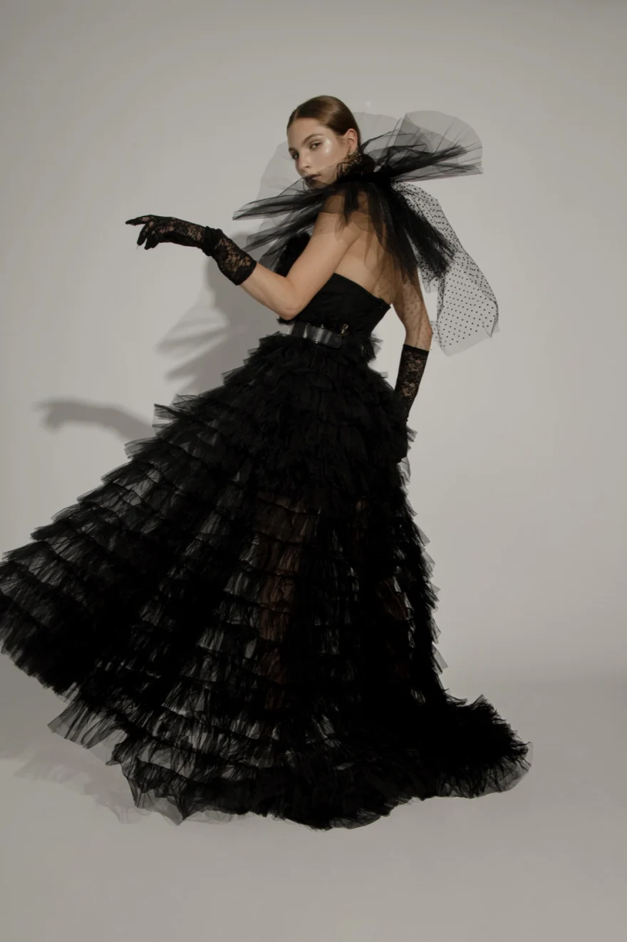 Model in a tiered black tulle gown with opera gloves and a veil, Iso Model Management editorial photographed by Ina Cenusa