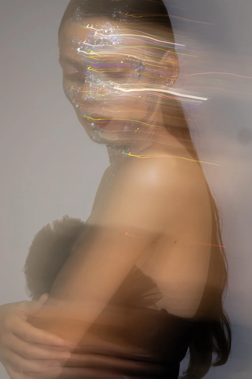 Long-exposure studio image with light trails tracing the model's movement, Iso Model Management editorial photographed by Ina Cenusa