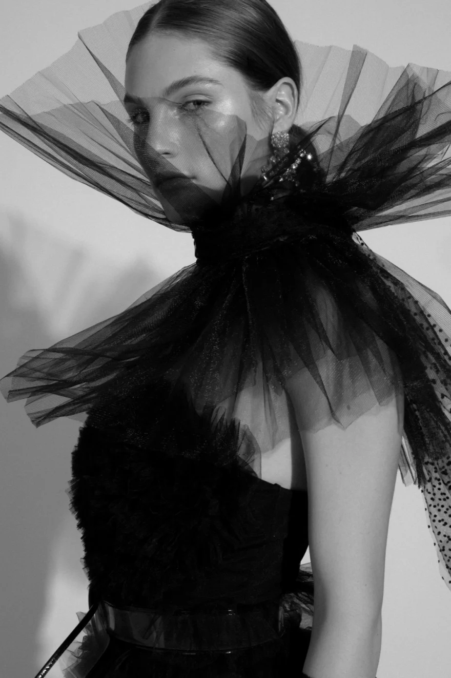 Black and white portrait with a dramatic black tulle collar, Iso Model Management editorial photographed by Ina Cenusa
