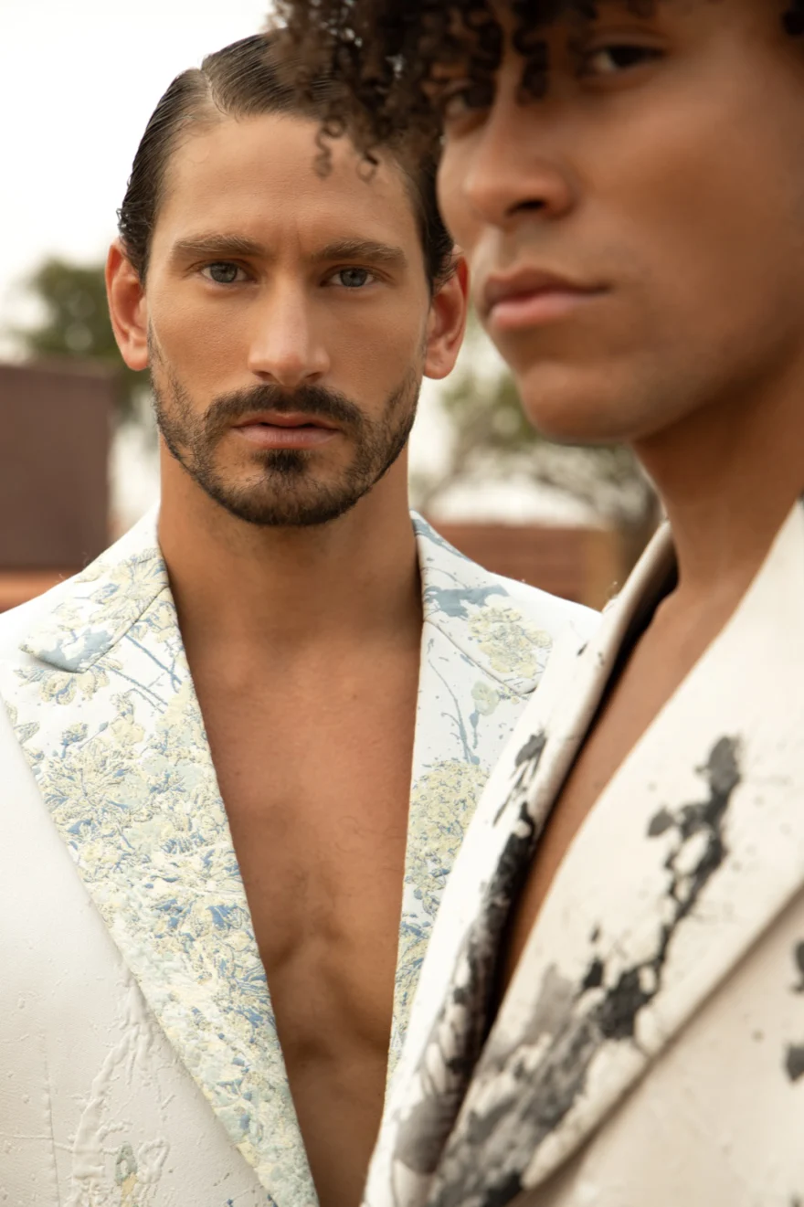 Close portrait of two men in embellished jackets, Philip Martin's campaign photographed by Ina Cenusa