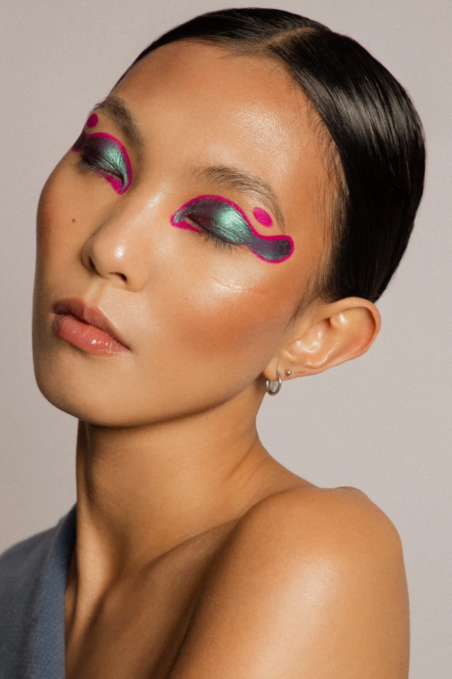 Frontal beauty portrait with sculptural pink and green eye make-up, LYX Magazine editorial photographed by Ina Cenusa