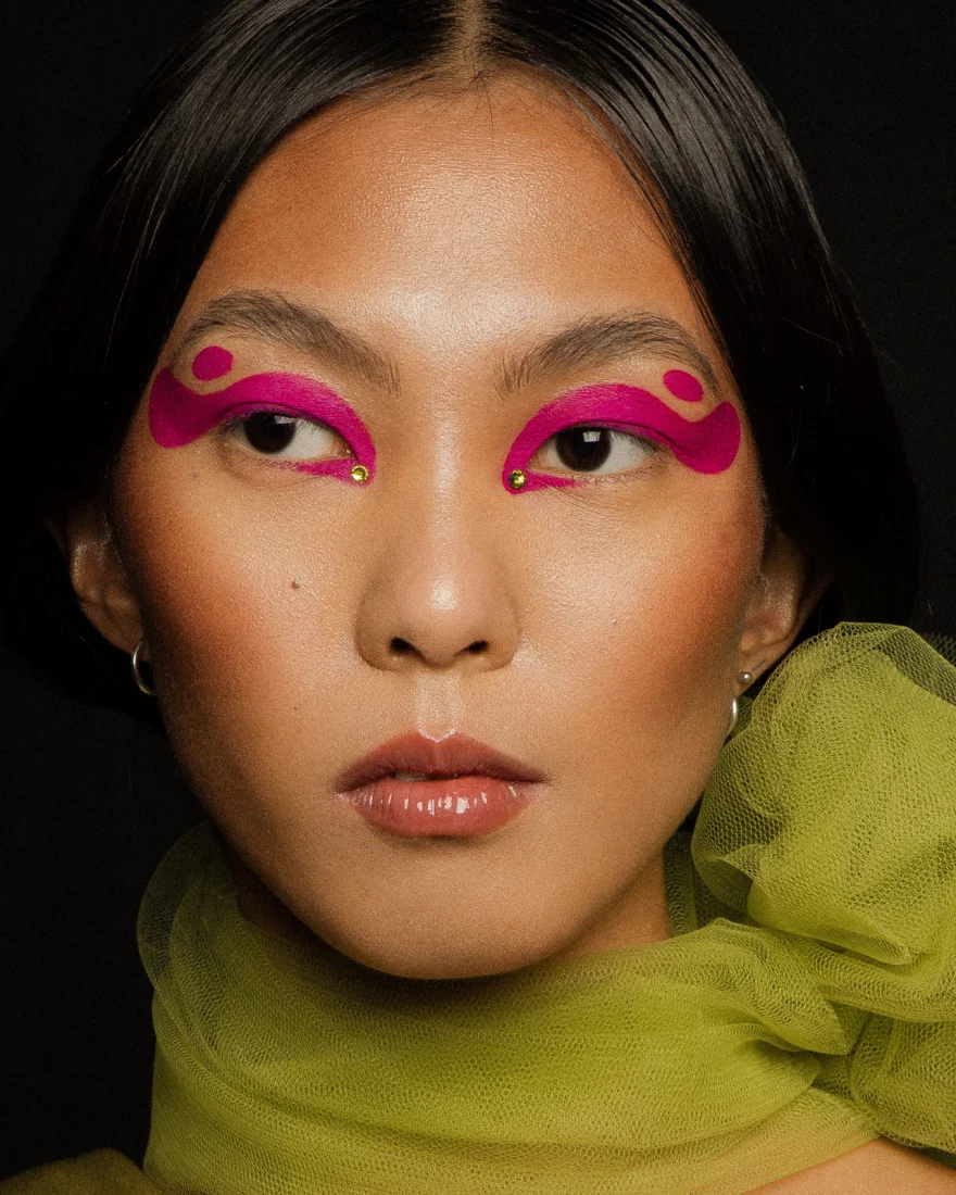 Beauty portrait with graphic pink and green eye make-up and lime tulle, LYX Magazine editorial photographed by Ina Cenusa
