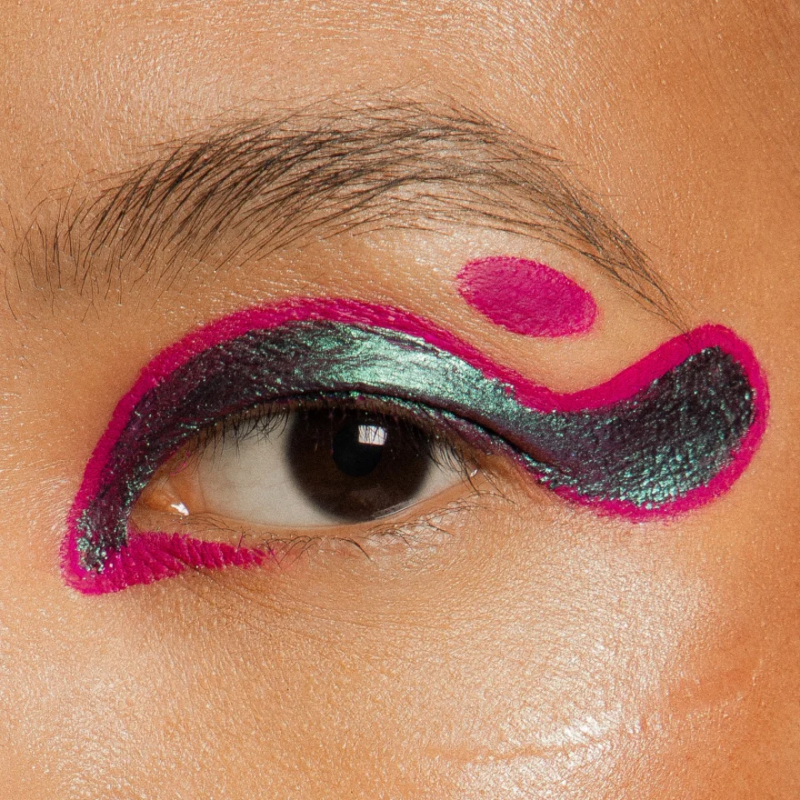 Macro detail of graphic fuchsia and metallic green eye make-up, LYX Magazine editorial photographed by Ina Cenusa