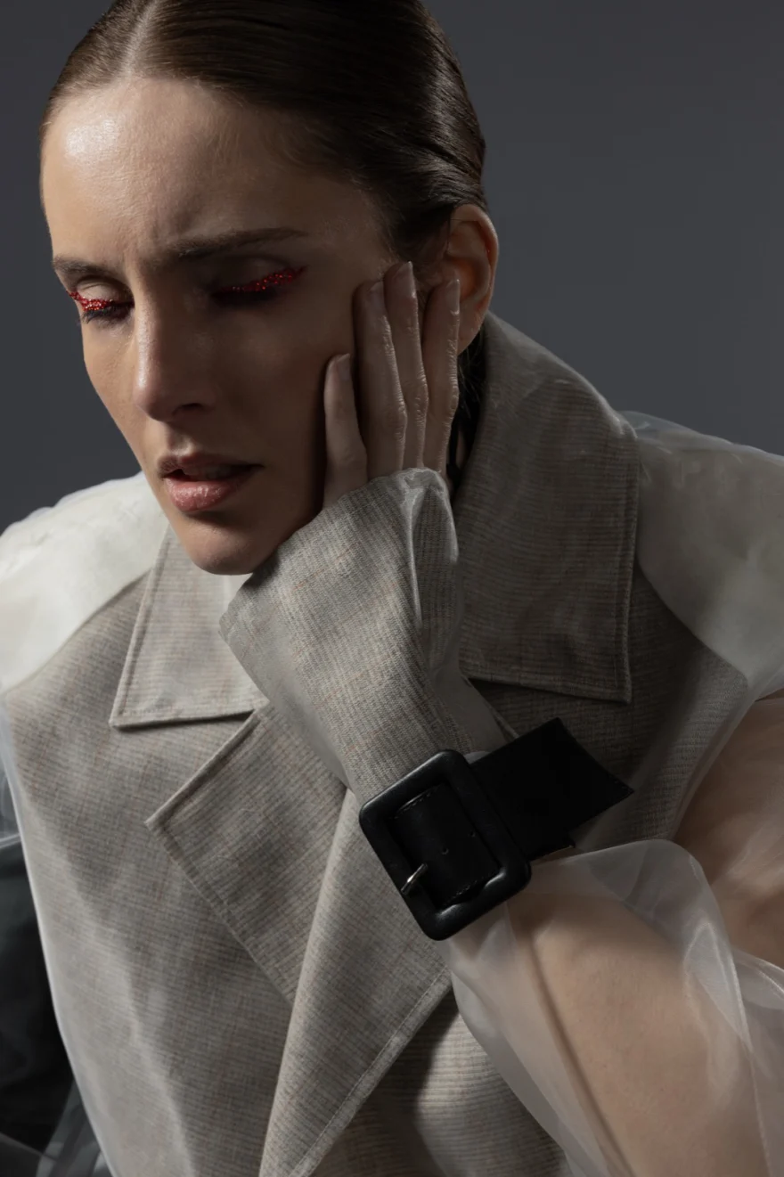 Beauty portrait with red-rimmed eye make-up and a linen coat, Hunter Magazine editorial photographed by Ina Cenusa