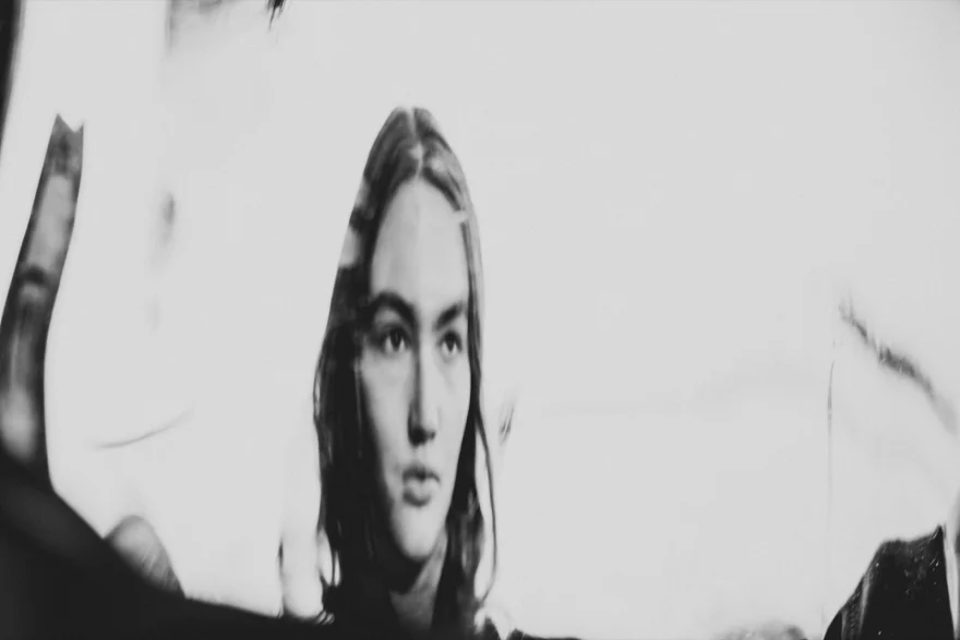 Experimental blurred portrait in high-key black and white, Daria personal project photographed by Ina Cenusa