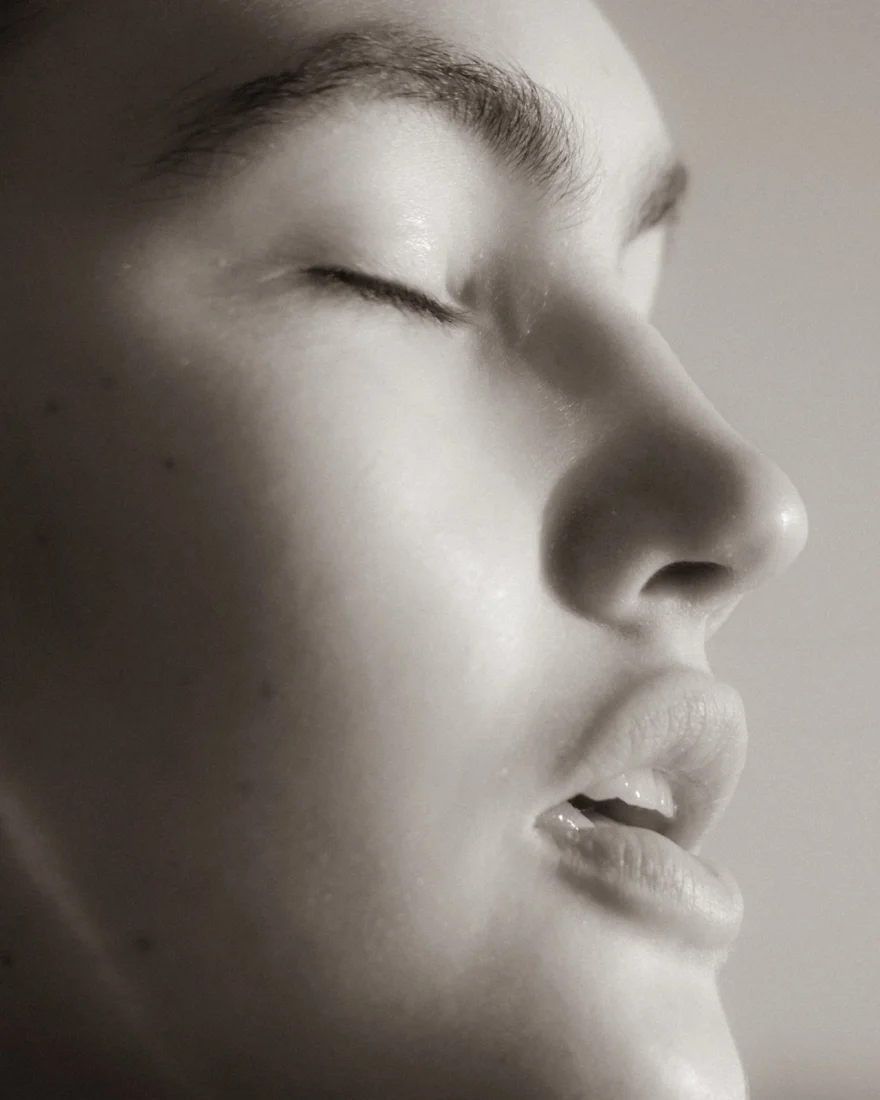 Beauty portrait with the face turned upward and eyes closed, Daria personal project photographed by Ina Cenusa