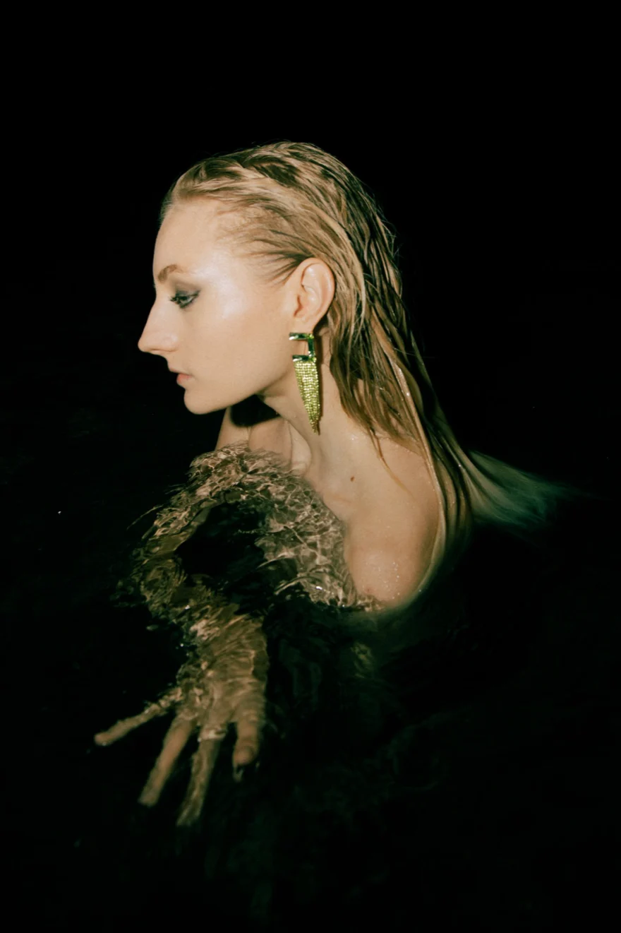 Green-toned profile portrait with a leaf-shaped earring, Amalfi Coast personal project photographed by Ina Cenusa