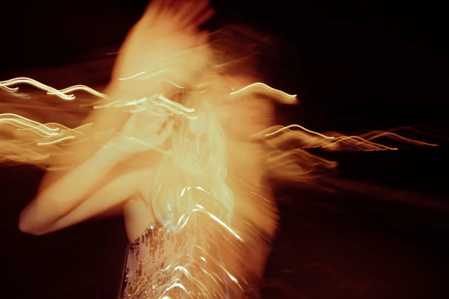 Long-exposure light streaks around a moving figure at night, Amalfi Coast personal project photographed by Ina Cenusa