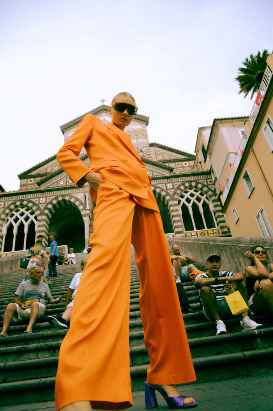 Low-angle shot of the orange suit on the cathedral steps in Amalfi, Amalfi Coast personal project photographed by Ina Cenusa