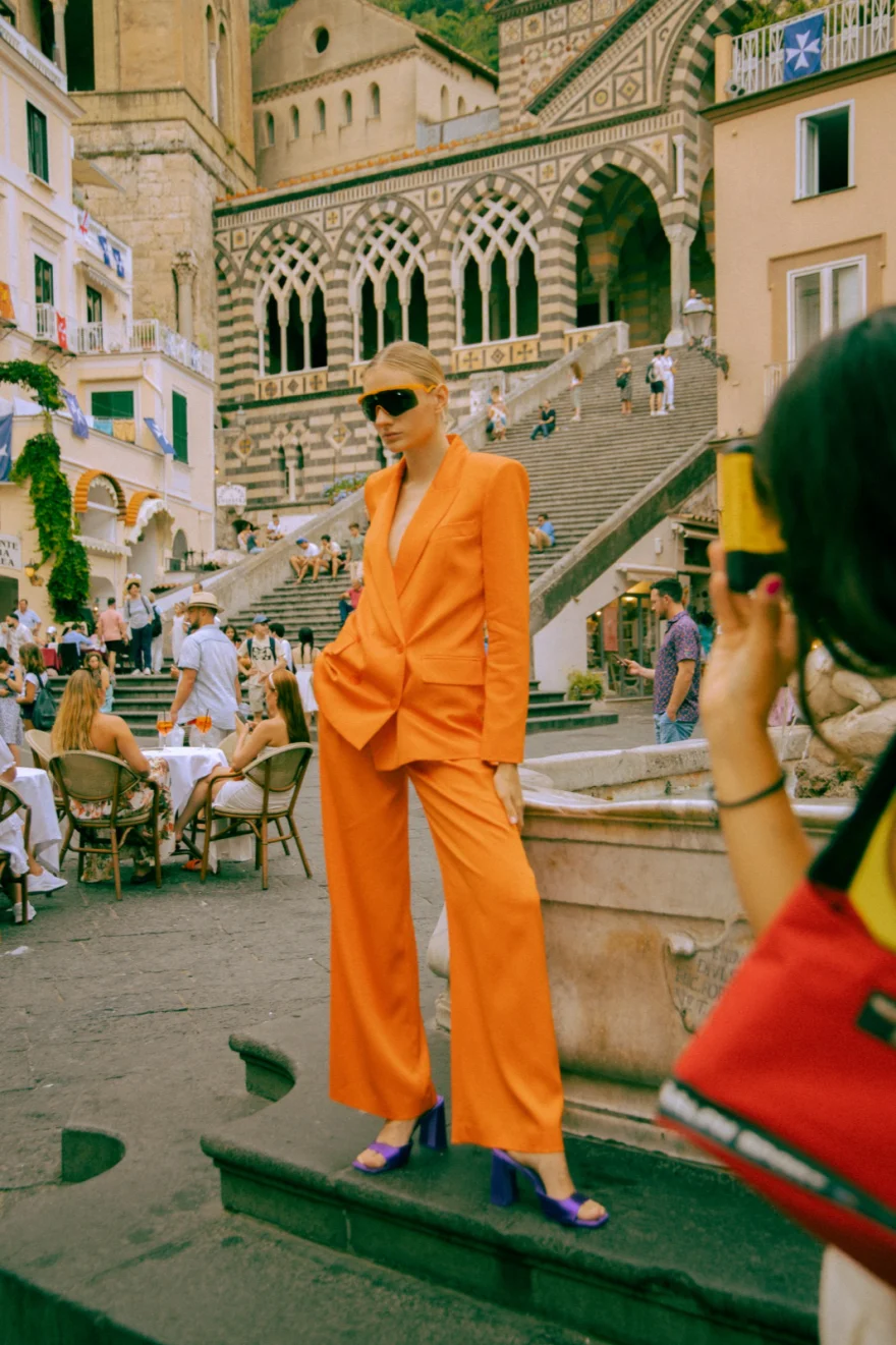 Model in orange photographed by a passer-by on the Amalfi steps, Amalfi Coast personal project photographed by Ina Cenusa