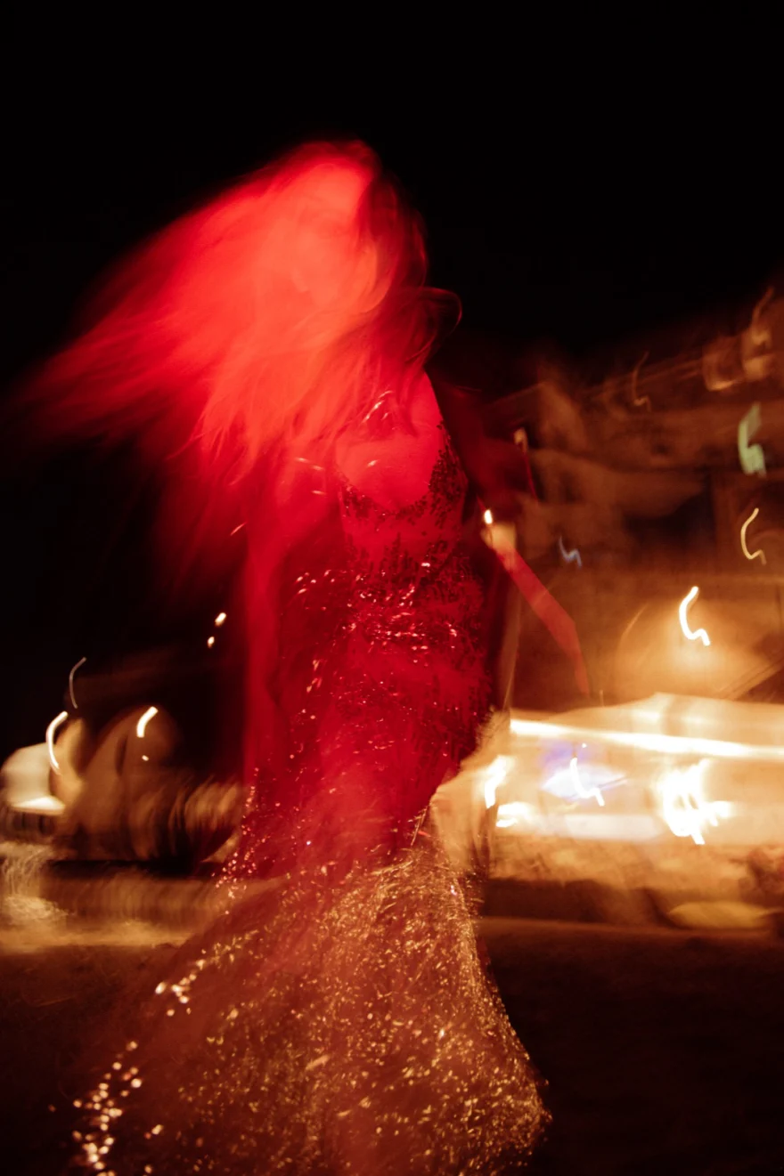 Motion-blurred figure in red light at night, Amalfi Coast personal project photographed by Ina Cenusa