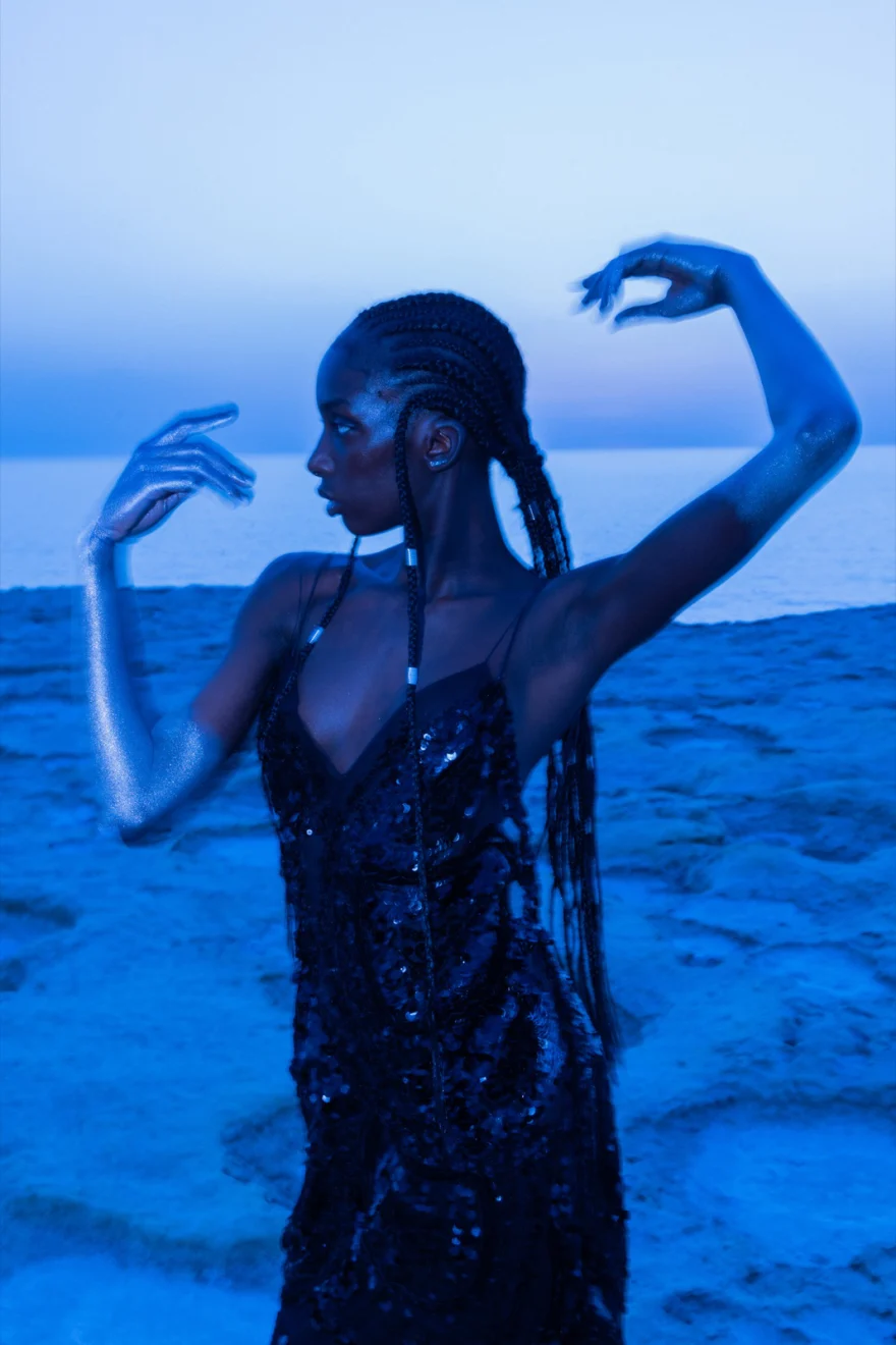 Model dancing in a black sequin dress in deep blue dusk light, Ermanno Scervino × SHOT Magazine editorial photographed by Ina Cenusa
