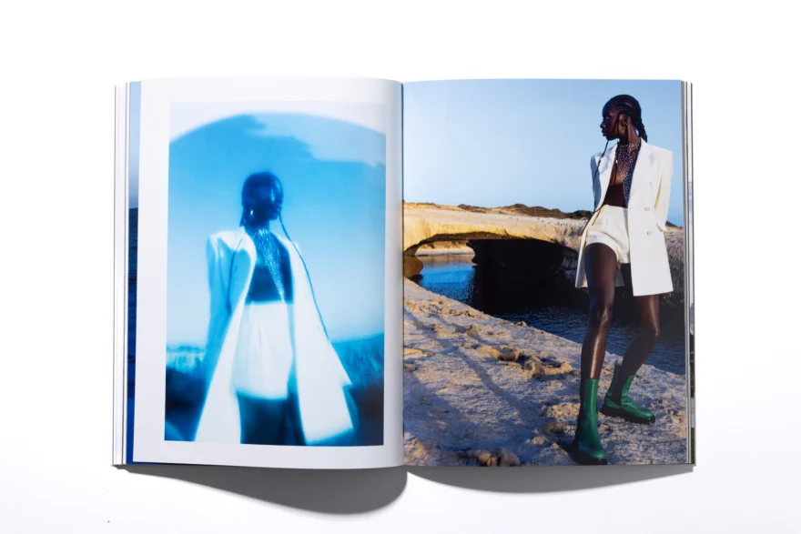 Printed magazine spread with the white looks by the rock arch, Ermanno Scervino × SHOT Magazine editorial photographed by Ina Cenusa