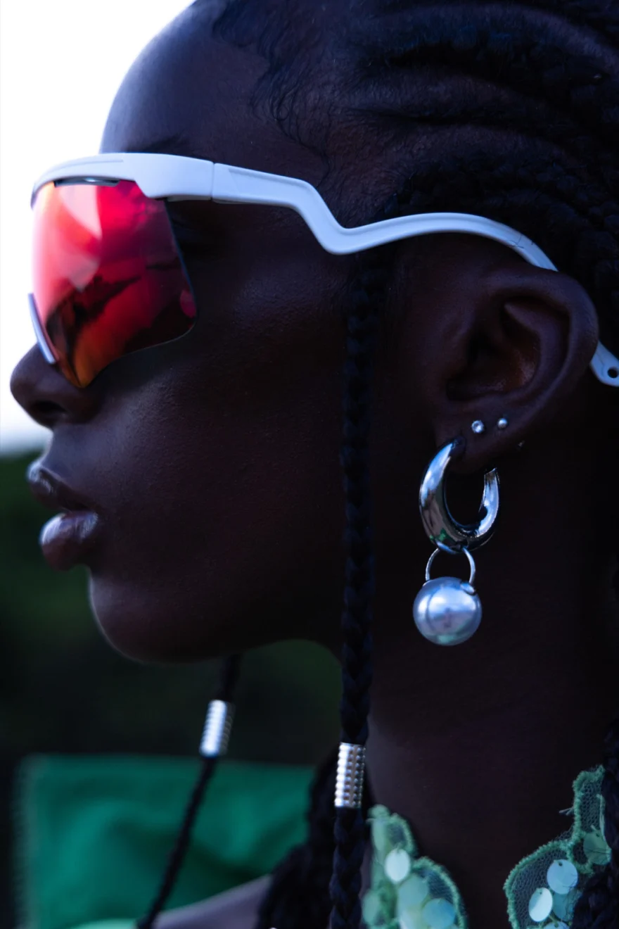 Profile portrait with a mirrored visor and silver earrings at dusk, Ermanno Scervino × SHOT Magazine editorial photographed by Ina Cenusa