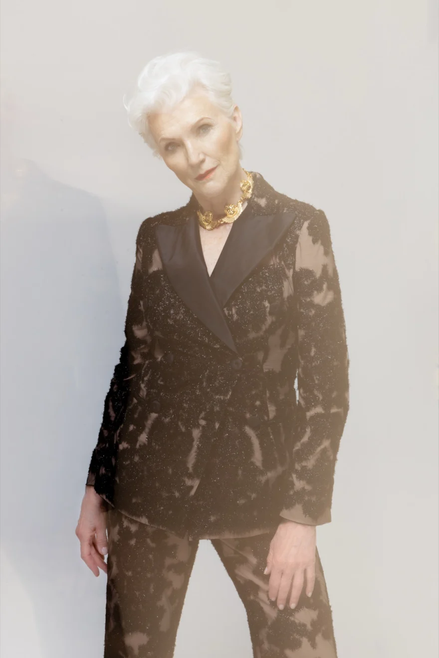 Maye Musk in a bronze sequinned suit against a soft grey ground, SHOT Magazine campaign photographed by Ina Cenusa