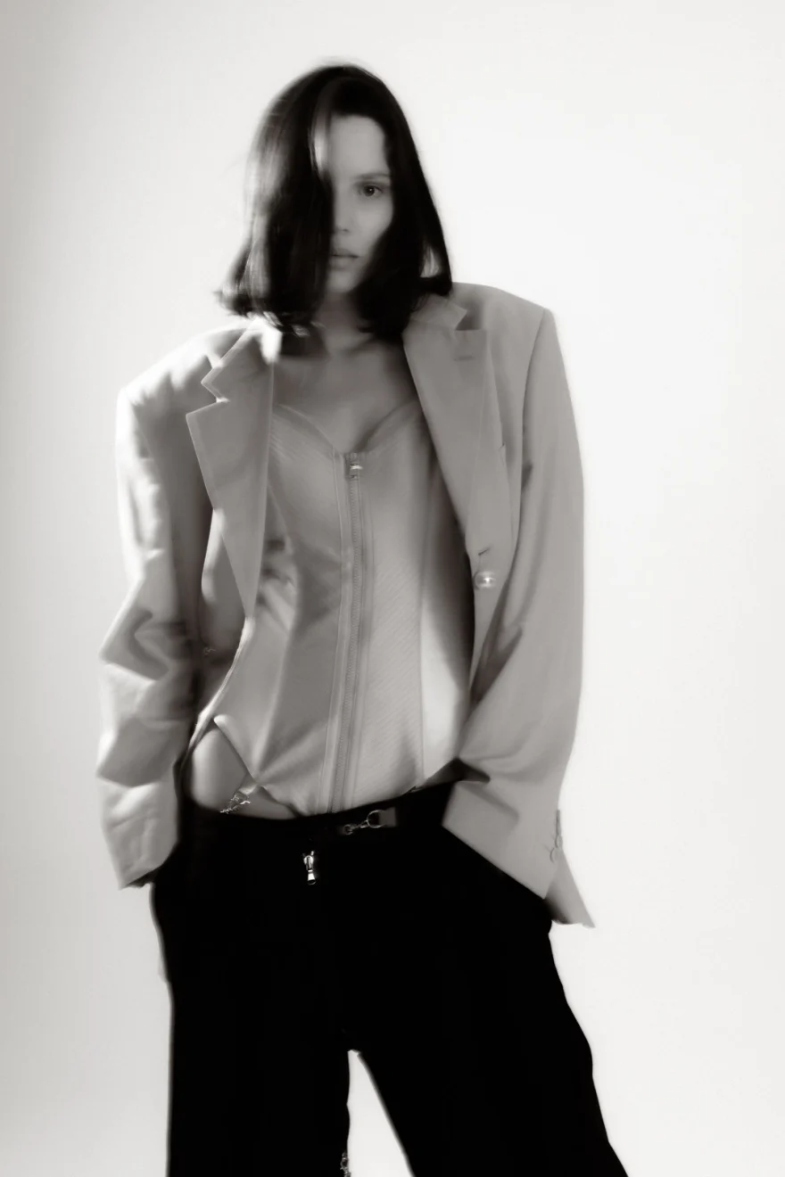 Soft-focus full-length portrait in a beige blazer and dark trousers, Sabina personal project photographed by Ina Cenusa