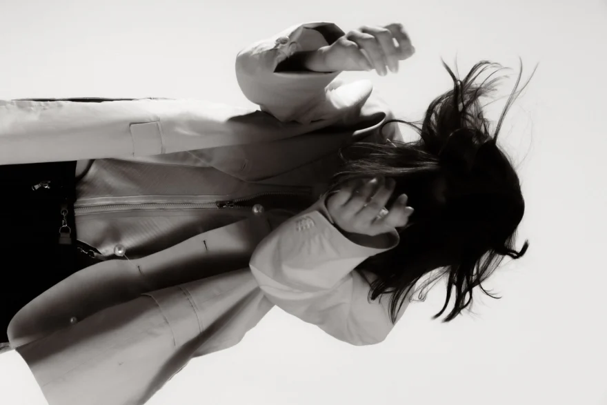 Motion study of a model in a white shirt with hair in movement, Sabina personal project photographed by Ina Cenusa