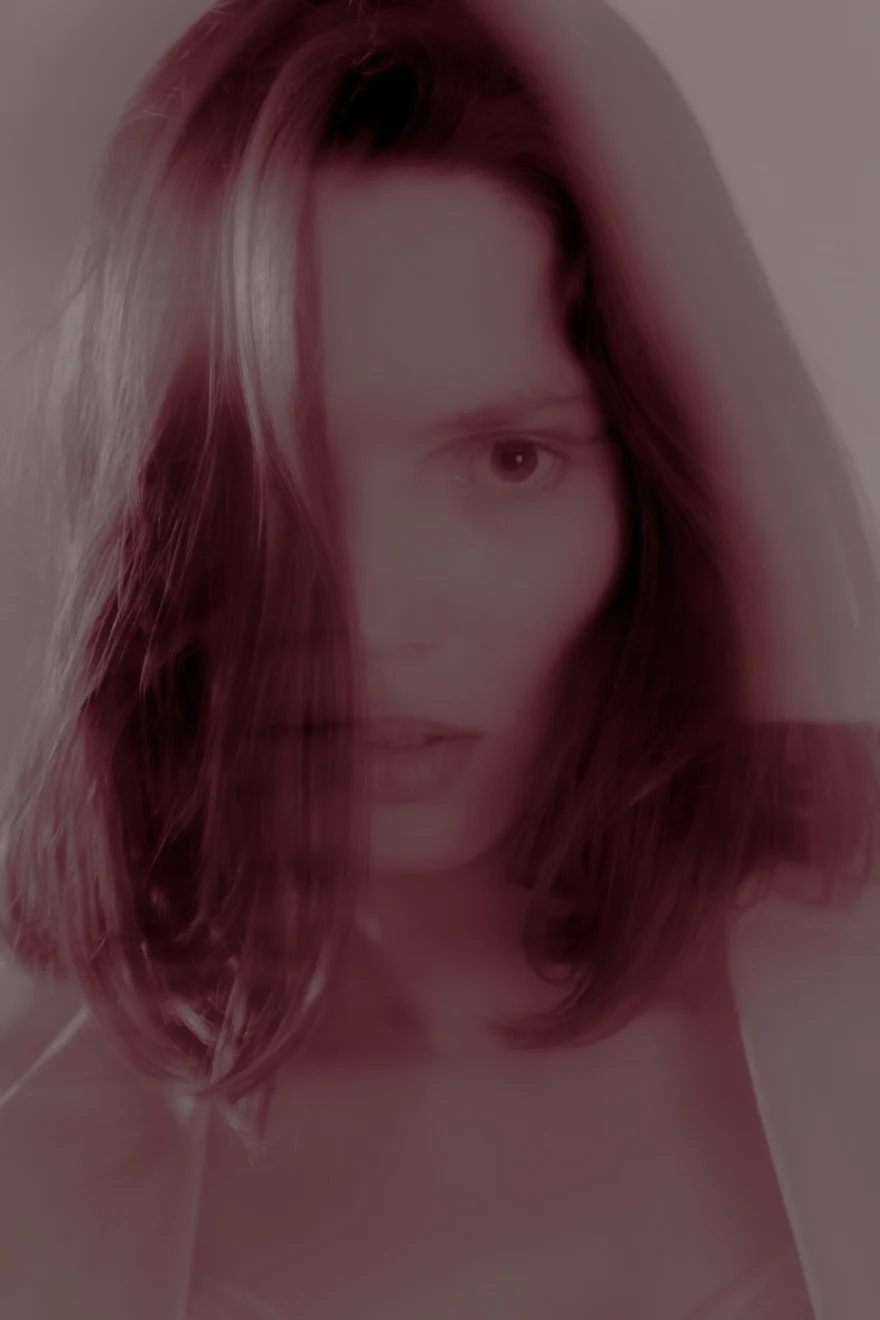 Soft-focus portrait veiled in red haze, Sabina personal project photographed by Ina Cenusa