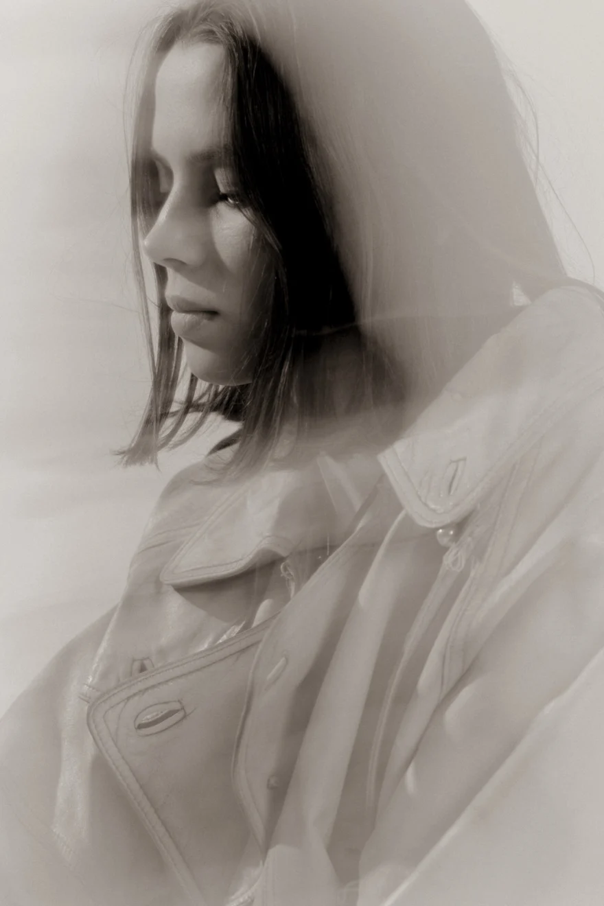 Hazy portrait in a white jacket with eyes closed, closing image of the story, Sabina personal project photographed by Ina Cenusa