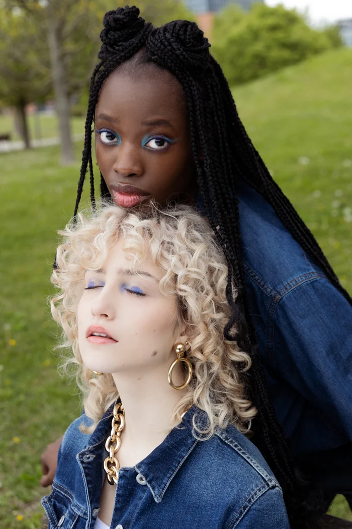 Two models in denim, one with long braids and one with blonde curls, Carrera Jeans campaign photographed by Ina Cenusa