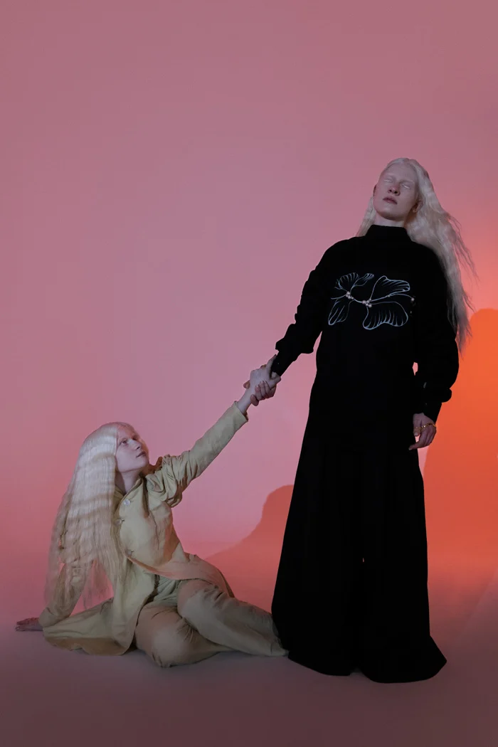 Two models in black and cream against a pink gradient, closing image of Tangled with Dreams, SHOT Magazine editorial photographed by Ina Cenusa