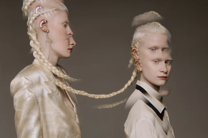 Two models in profile with long braids linking them together, SHOT Magazine editorial photographed by Ina Cenusa