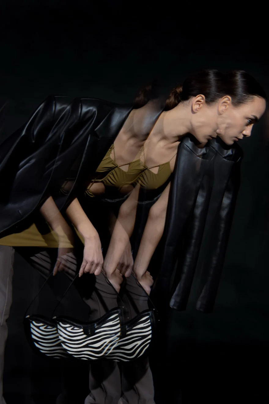 Multiple-exposure figure with a zebra-print bag, Noesi campaign photographed by Ina Cenusa