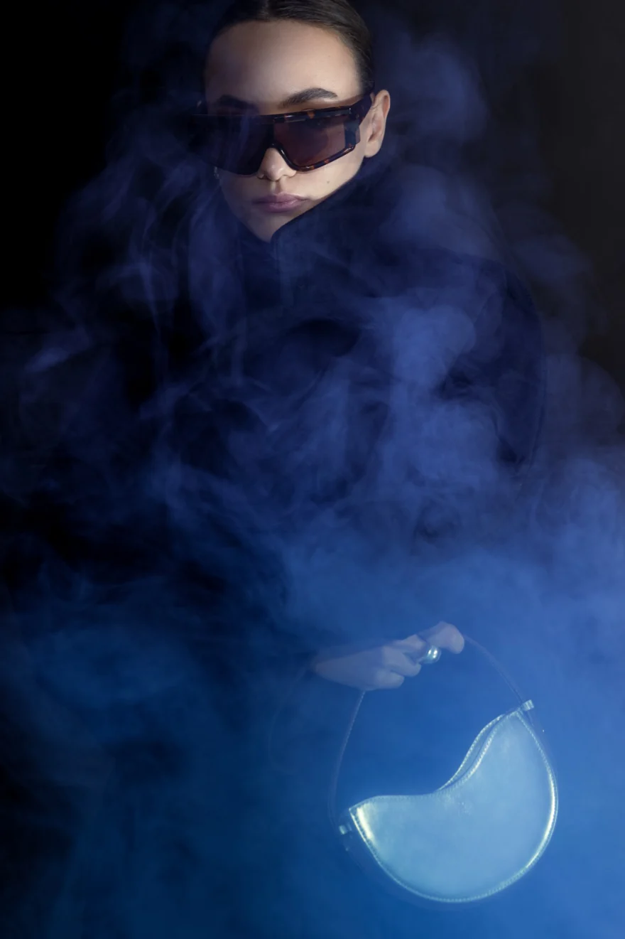 Campaign portrait with a leather bag, Noesi campaign photographed by Ina Cenusa
