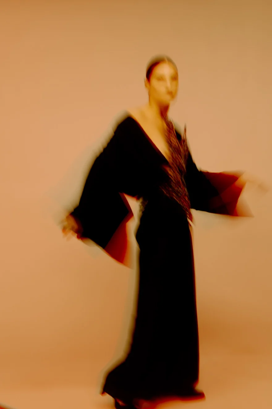 Motion-blurred fashion portrait of a model in a flowing black kimono-style dress, SHOT Magazine editorial photographed by Ina Cenusa