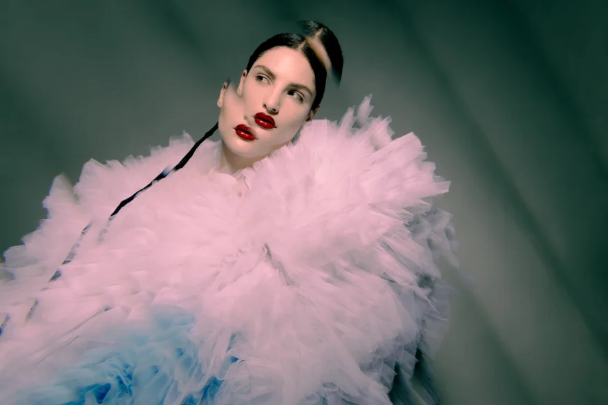Portrait of a model in a pink tulle collar against a teal background, Aetherial Beauty Whispers editorial, SHOT Magazine editorial photographed by Ina Cenusa
