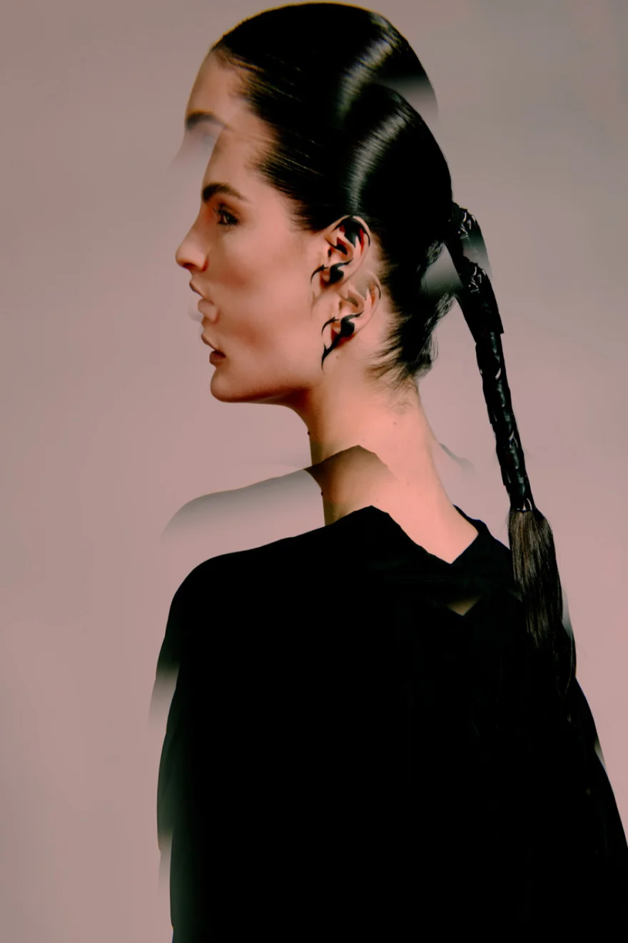 Profile portrait of a model in a black look with a braided hairstyle, SHOT Magazine editorial photographed by Ina Cenusa