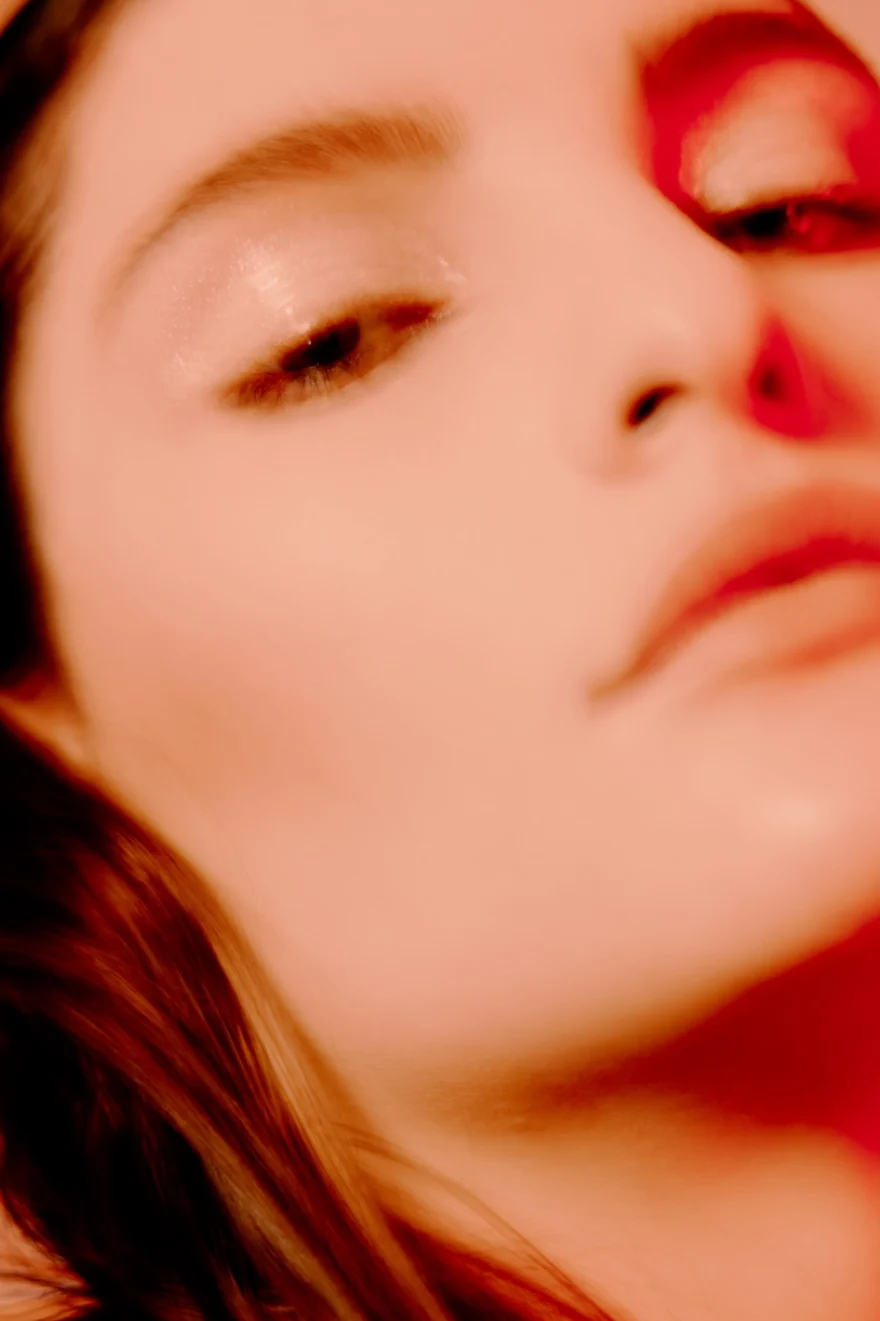 Soft-focus close-up beauty portrait in warm tones, SHOT Magazine editorial photographed by Ina Cenusa