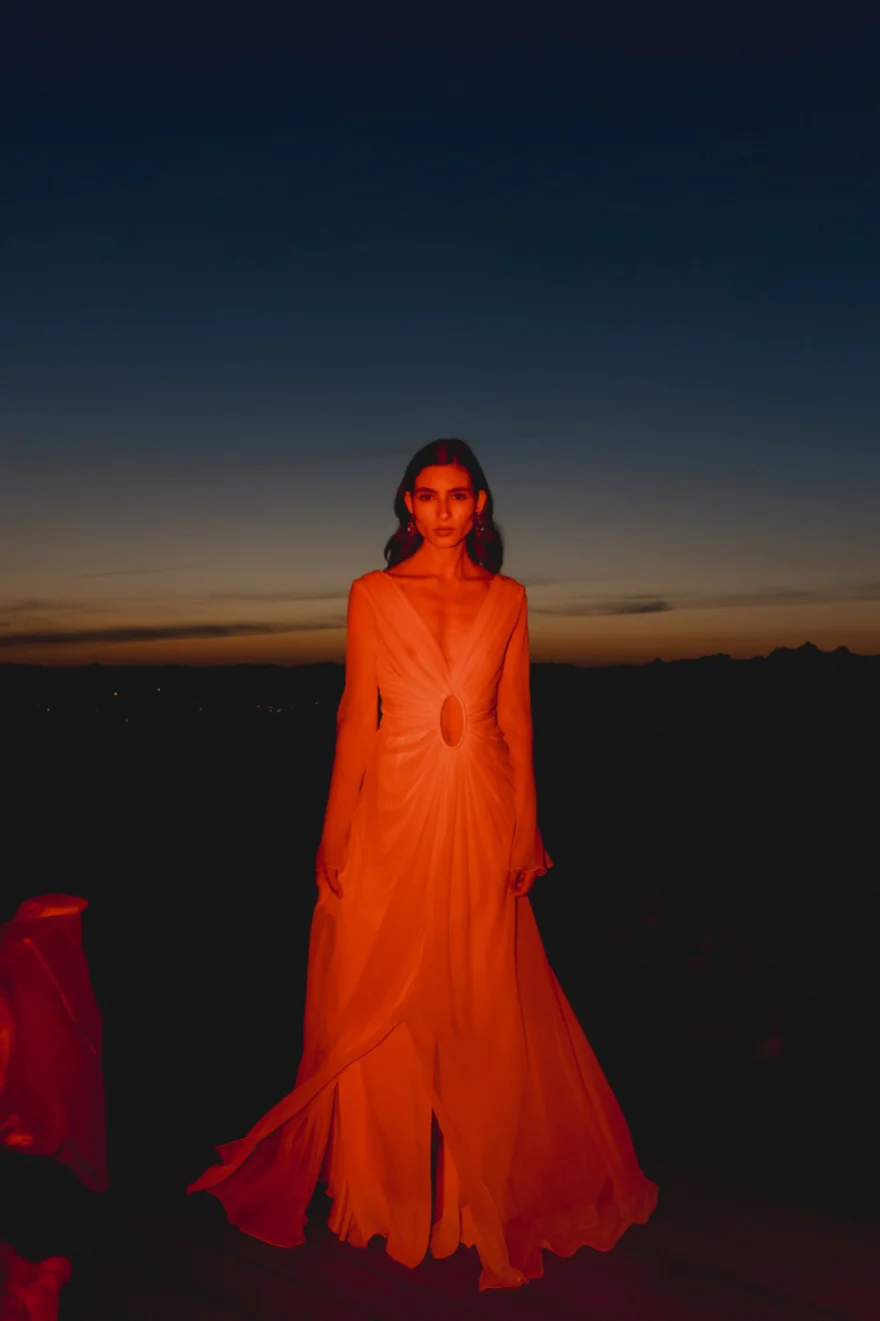 Model in a flowing orange gown at blue hour, closing image of Petra Segreta, SHOT Magazine editorial photographed by Ina Cenusa