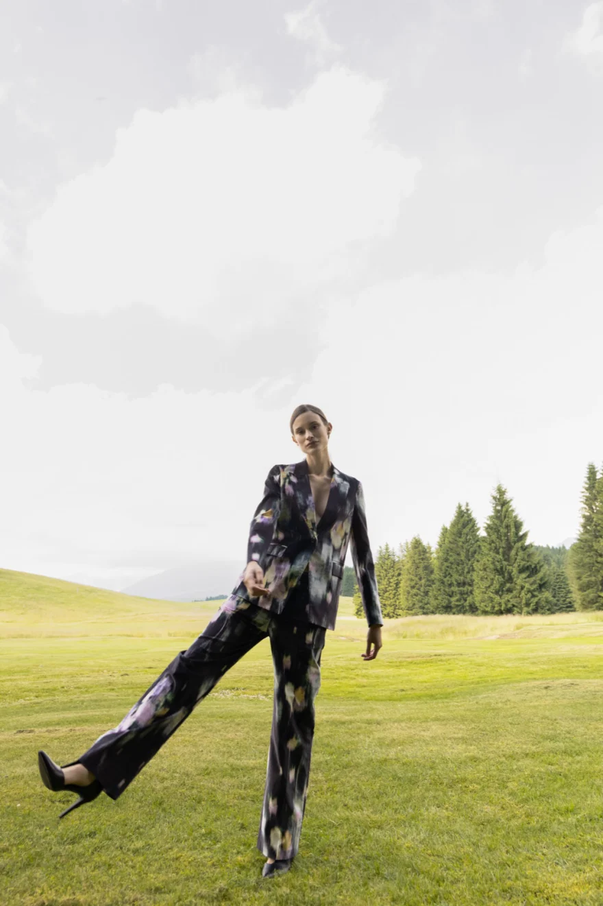 Model walking through tall grass, Camicetta Snob campaign photographed by Ina Cenusa