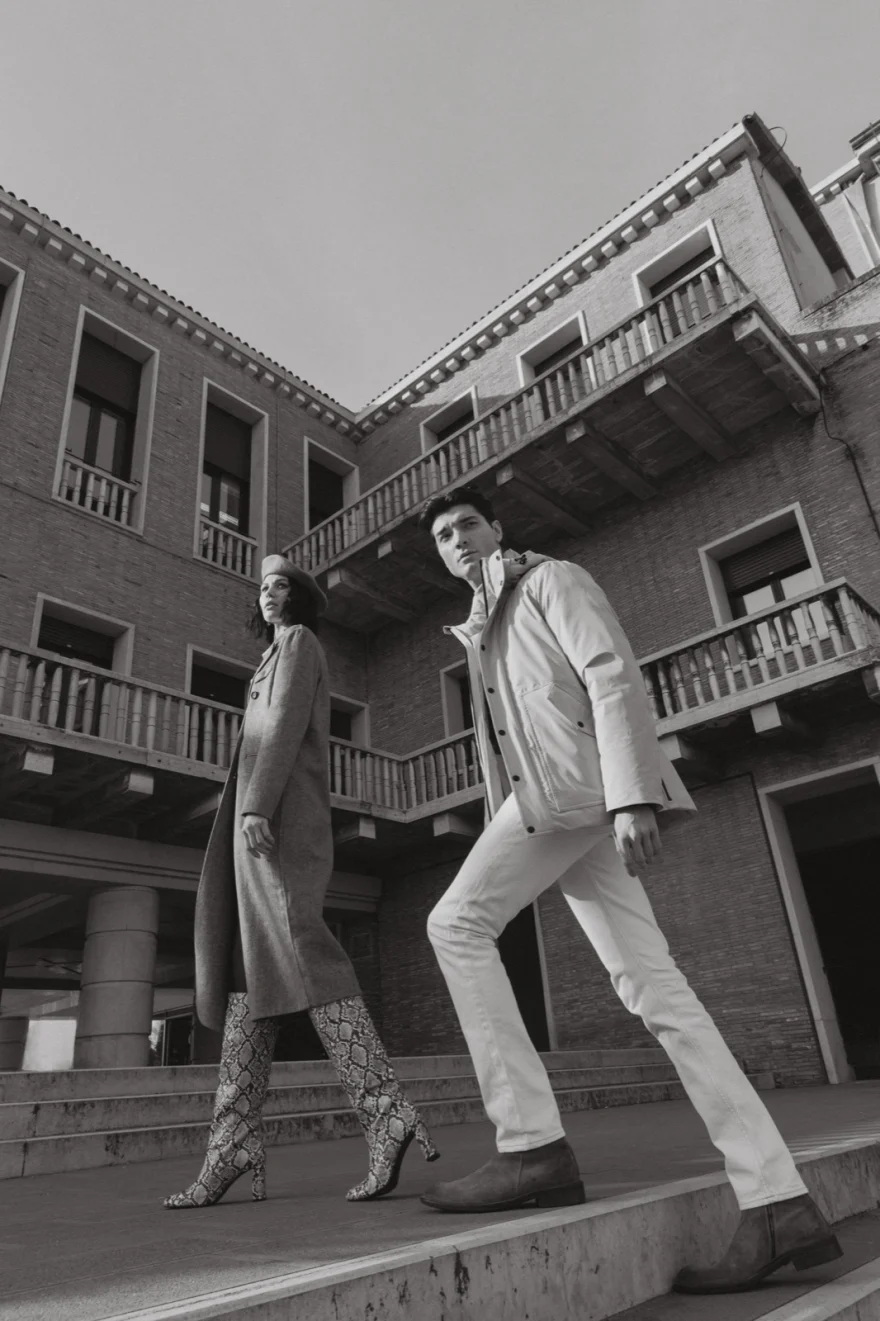 Two models walking down steps in front of a Venetian palazzo, Mabrun campaign photographed by Ina Cenusa