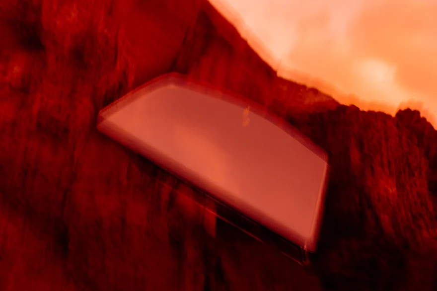 Clutch bathed in intense red light, abstract still life detail, Noesi campaign photographed by Ina Cenusa