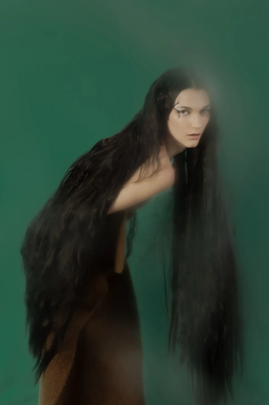 Hazy portrait with long flowing hair on a green backdrop, SHOT Magazine editorial photographed by Ina Cenusa