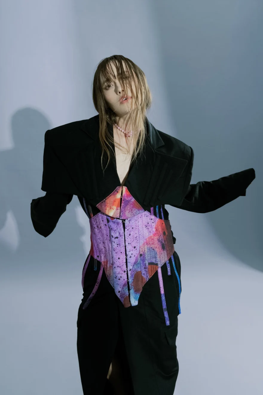 Dancer in an oversized black blazer over a pink and orange corset, SHOT Magazine editorial photographed by Ina Cenusa