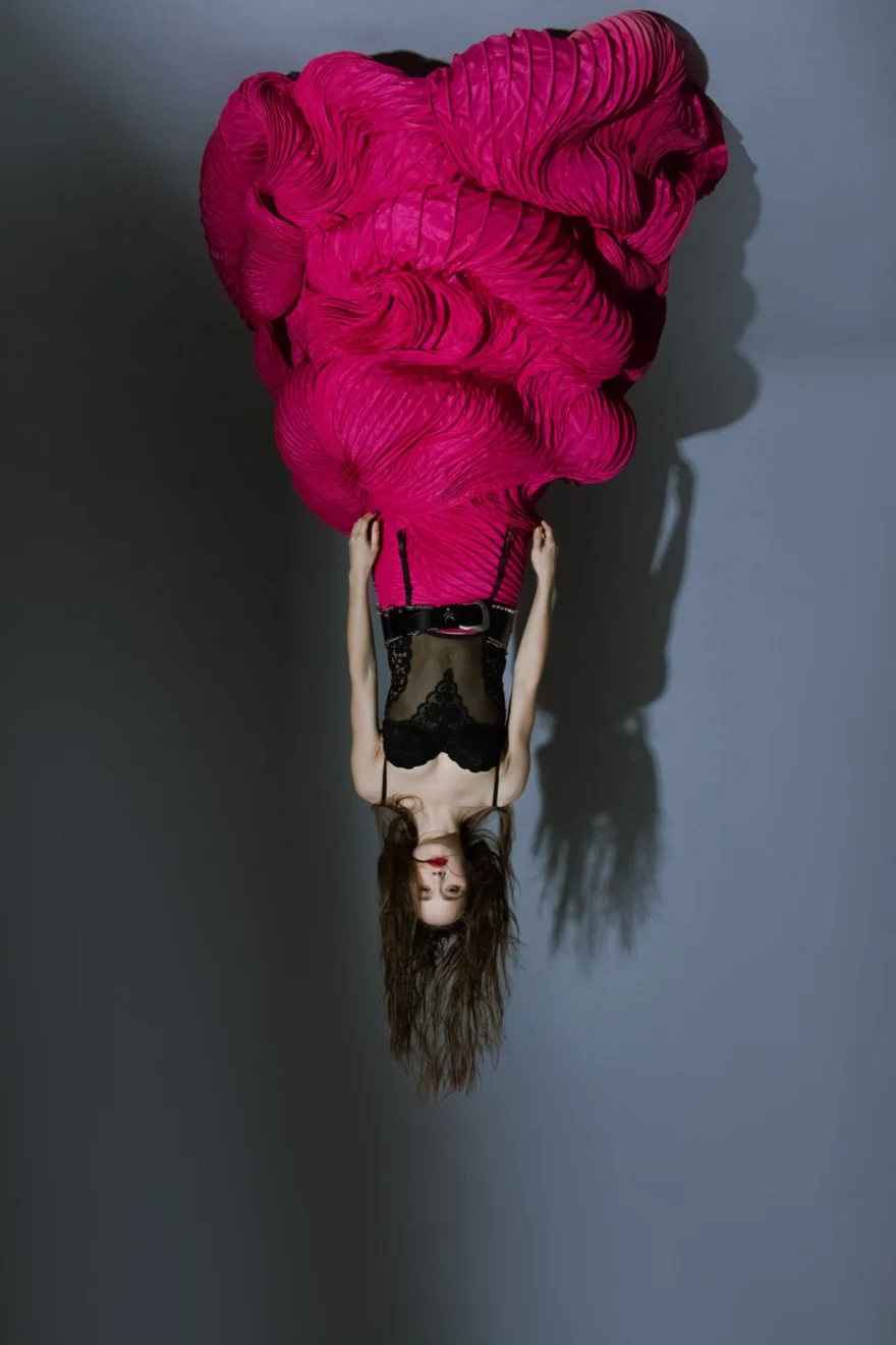 Inverted composition of a voluminous fuchsia dress against grey, SHOT Magazine editorial photographed by Ina Cenusa