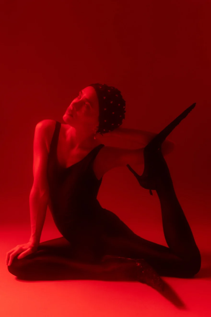Dance pose on the floor lit entirely in red, SHOT Magazine editorial photographed by Ina Cenusa
