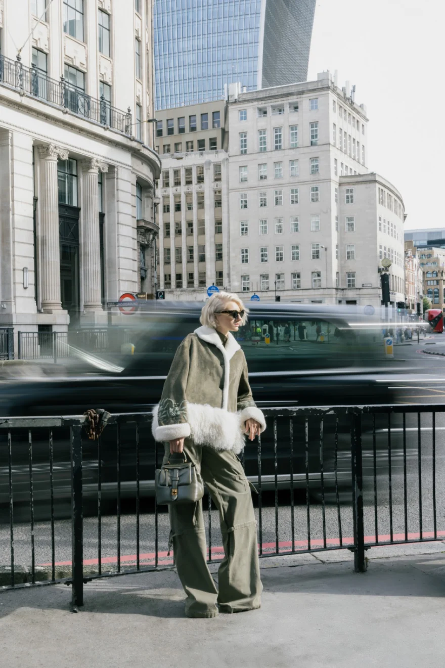 Model with a fur stole against the City of London skyline, traffic blurred behind, Ermanno Scervino campaign photographed by Ina Cenusa