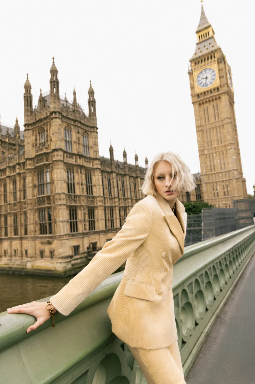 Model in a cream suit on Westminster Bridge with Big Ben behind, Ermanno Scervino campaign photographed by Ina Cenusa