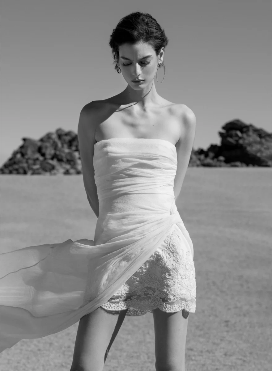 Model in a belted shirt dress on the shore, Ermanno Scervino campaign photographed by Ina Cenusa