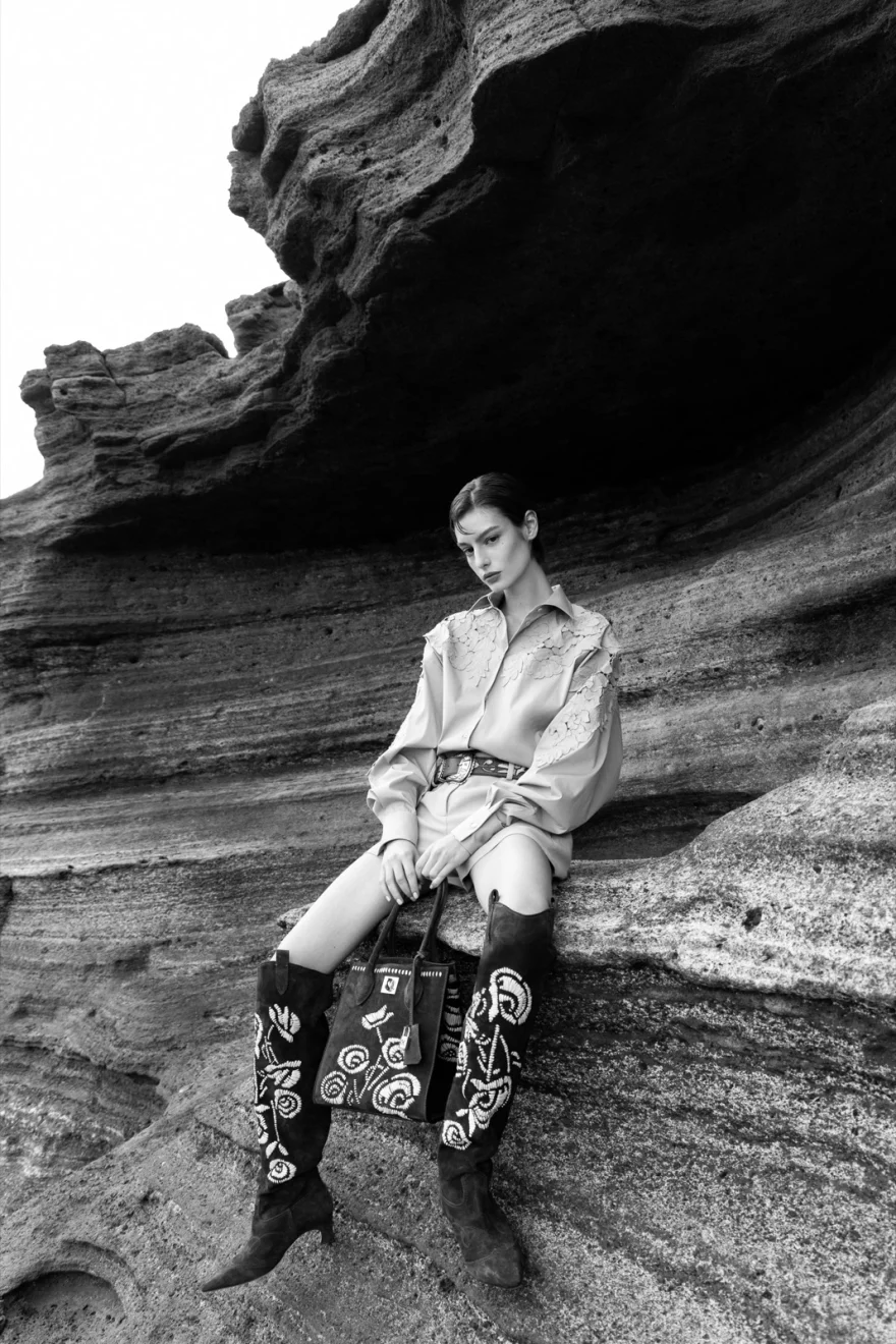 Black and white shot of a look with tall boots, Ermanno Scervino campaign photographed by Ina Cenusa