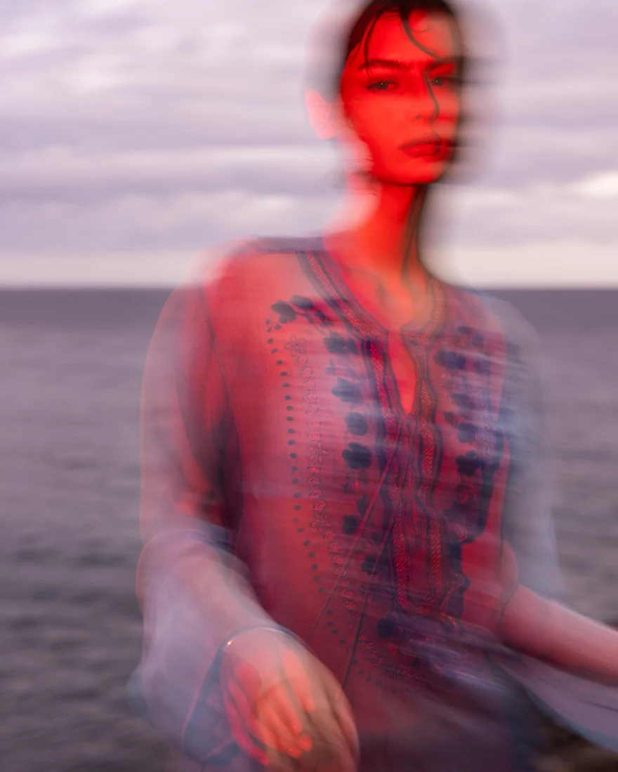 Floral blouse caught in soft motion blur, Ermanno Scervino campaign photographed by Ina Cenusa