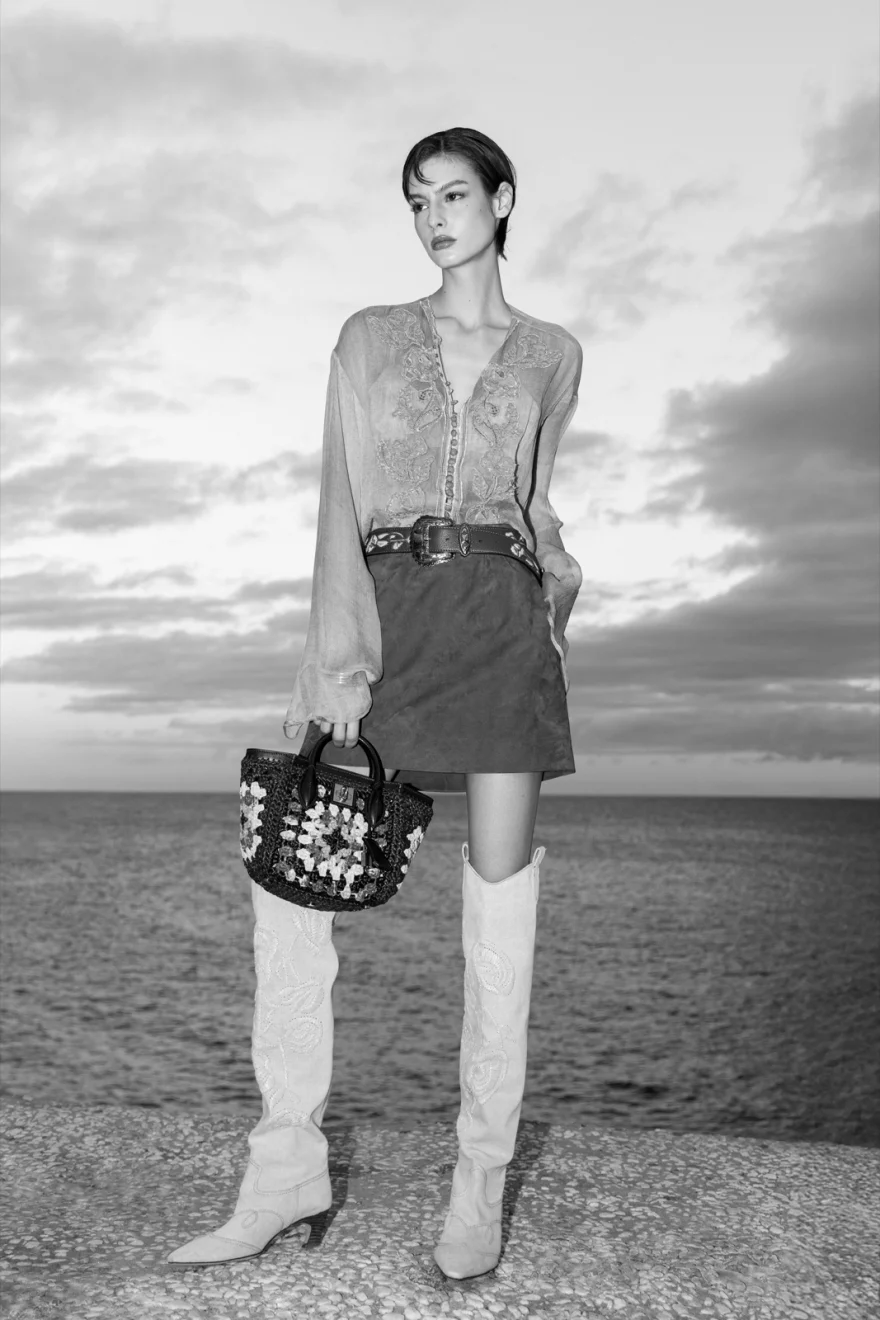 Model in white trousers walking the beach, Ermanno Scervino campaign photographed by Ina Cenusa