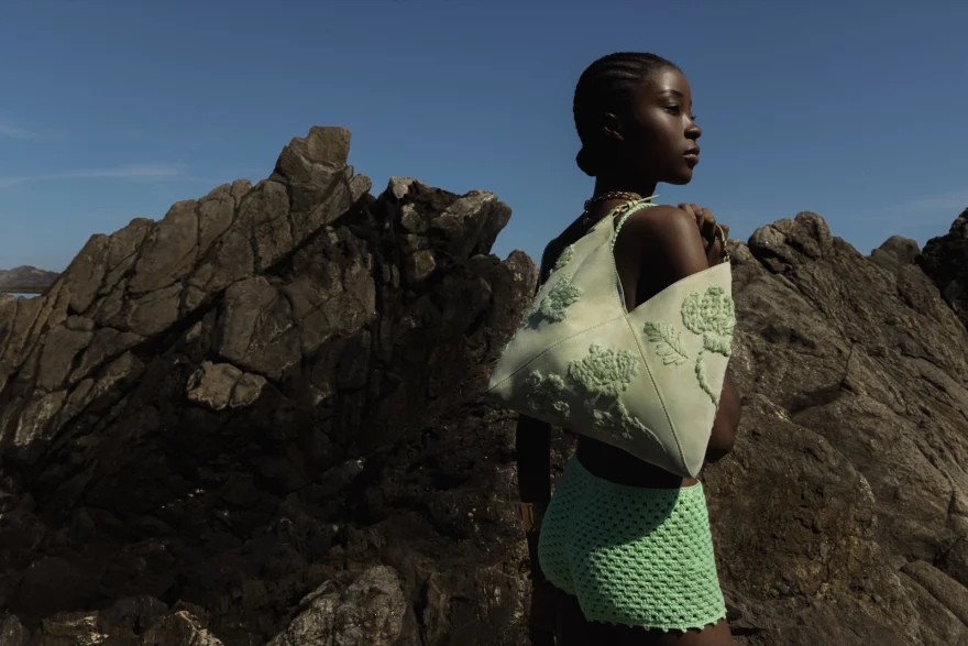 Portrait in a silver jacket against the rocks, Ermanno Scervino campaign photographed by Ina Cenusa